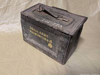 Three-quarter view of the steel ammunition box