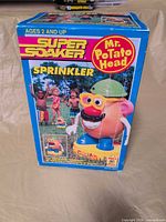 Front view of sealed Super Soaker Mr. Potato Head Sprinkler box
