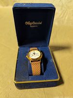 Wristwatch in open blue Oleg Cassini box