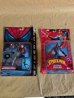 Front view of both sealed Spider-Man figures in packaging
