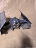 Front angled view of TIE Fighter showing cockpit and both wings attached