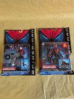 Front view of both sealed Spider-Man figures on damaged cards