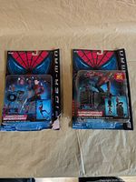 Both carded Spider-Man figures side by side showing overall packaging and damage