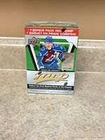 Front view of sealed Upper Deck MVP 2025-26 hockey blaster box