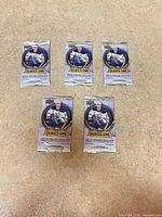 Front view showing five sealed 2025-26 Series One hockey card packs