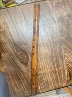 Full view of bamboo flute on tabletop