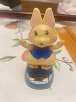 Front view of bunny figurine on solar base