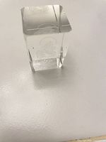 front view of rectangular crystal block showing etched Madonna image