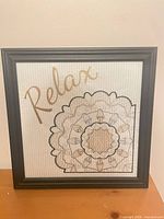 Full view of framed cross stitch wall art