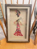 Front view of framed artwork showing full figure and frame