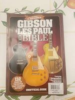 Front cover showing title, graphics of three Les Paul guitars and text indicating unofficial guide and 132 pages