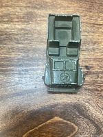 Top view of diecast military jeep showing interior and paint wear