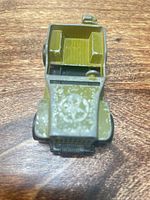 Front top view showing star emblem, grille and paint wear