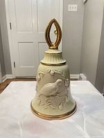 Front view showing relief bird, pears and gold trim