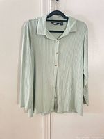Full view of Lands' End mint ribbed shirt hanging