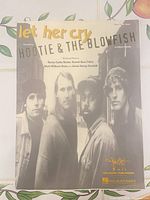 Front cover showing title, band photo, publishers