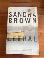 Front cover showing title, author, sticker residue and wear