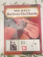 Front cover showing title, brand, ukulele photo and chord diagram inset