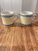 Both demitasse cups front view showing pattern and marking