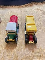 Top view of both trucks showing colors and signage