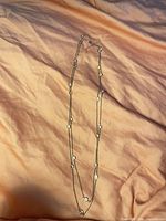 Full view of necklace doubled up showing overall length and stations