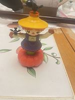 Front view of scarecrow figurine on pumpkin base