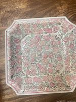 Top view showing full floral pattern and square shape with canted corners