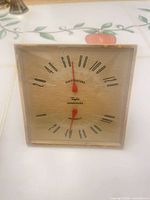 Front view showing Taylor thermometer hygrometer face and needles