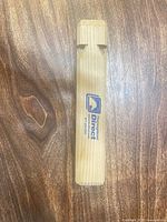 Front view showing Thoroughbred Direct logo on wooden whistle