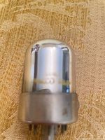 Vacuum tube side view showing chrome mirrored envelope and 7F8 stamping