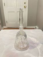 full view of the hand bell standing upright