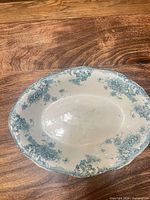 top view showing oval shape, floral border, interior wear