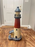 Front view showing full lighthouse and attached cottage