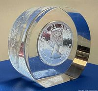 Oblique view of acrylic cylinder showing Queen Elizabeth II obverse