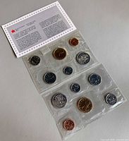 Both proof-like sets with information card visible