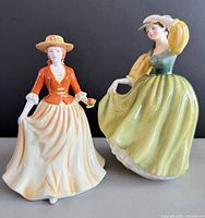 Front view of both Royal Doulton figurines