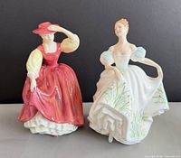 Both figurines side by side showing overall design and scale