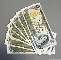 Six fanned Canadian $1 notes obverse view