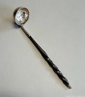 Full view of ladle showing bowl and twisted handle