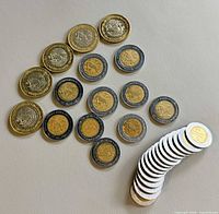 All coins laid out showing both denominations and relative sizes