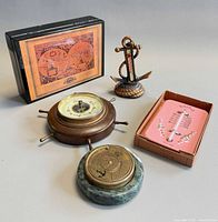 Group shot of all four weather instruments and packaging