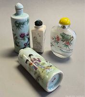 All four snuff bottles showing size and shapes
