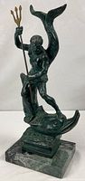 Full view of bronze Neptune sculpture on marble base