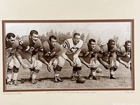 Close view of photo showing six 49ers players in stance