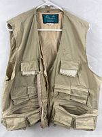 Full front view of vest showing pockets and zipper
