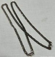 Full view of entire 24" chain necklace laid flat