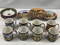 Group view of 8 mugs, 5 bowls, 7 plates