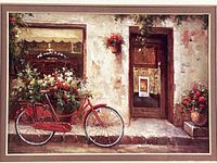 Detail of the photo print showing red bicycle and storefront scene