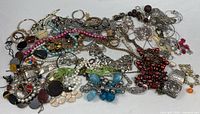 Overview of entire pile of assorted costume jewellery