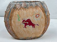 Full view of vase front with bison motif